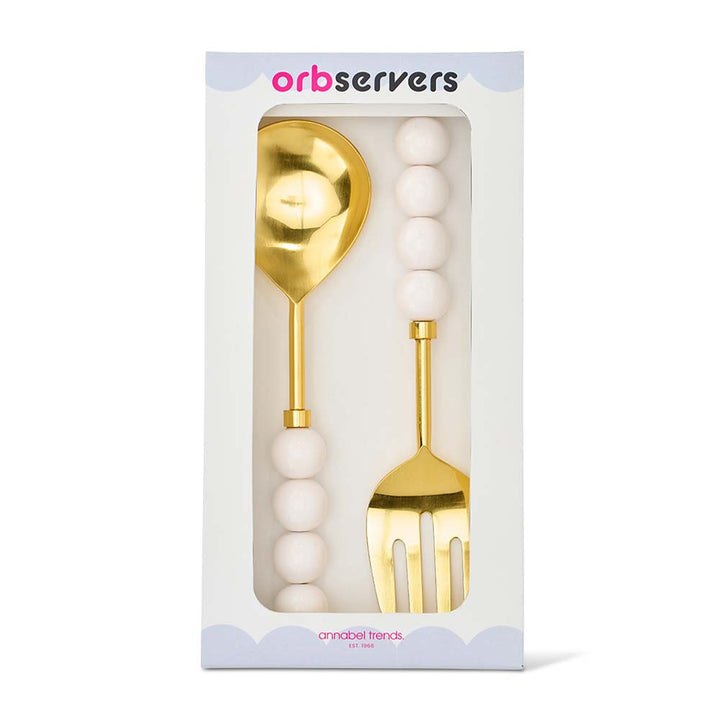 Gold spoon and fork set in packaging with 'orbservers' branding.