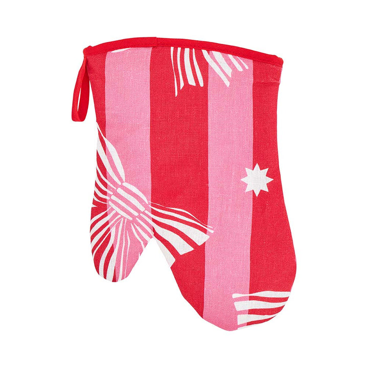 Red and pink oven mitt with white patterns on a white background