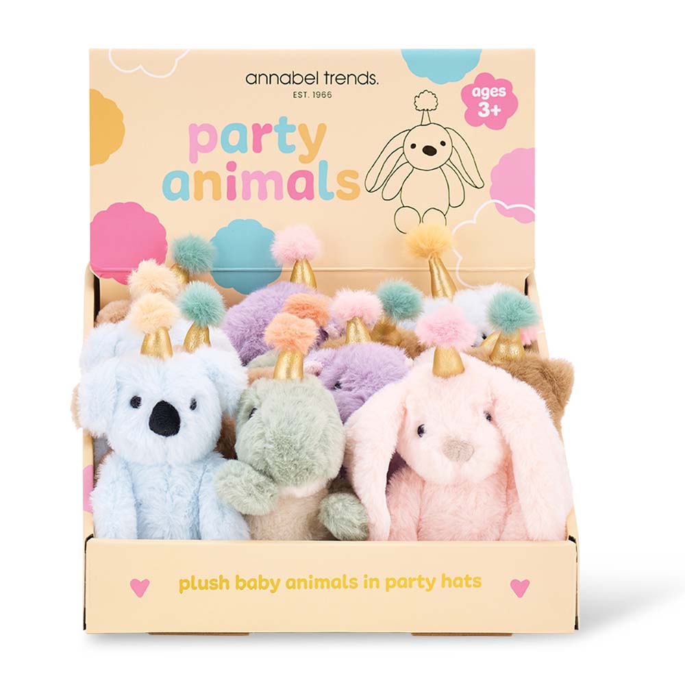 Box of plush baby animals in party hats by Annabel Trends on a white background