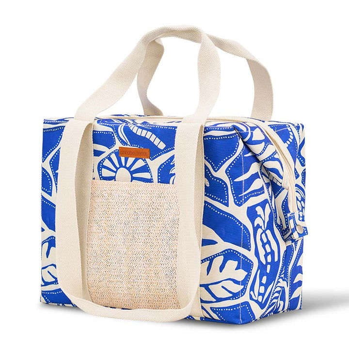 Blue and white patterned bag with a textured pouch on a white background