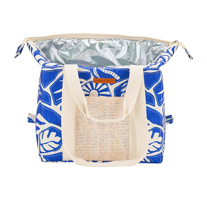 Blue and white patterned cooler bag with beige handles on a white background