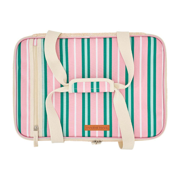 Striped pink and green bag with a handle on a white background
