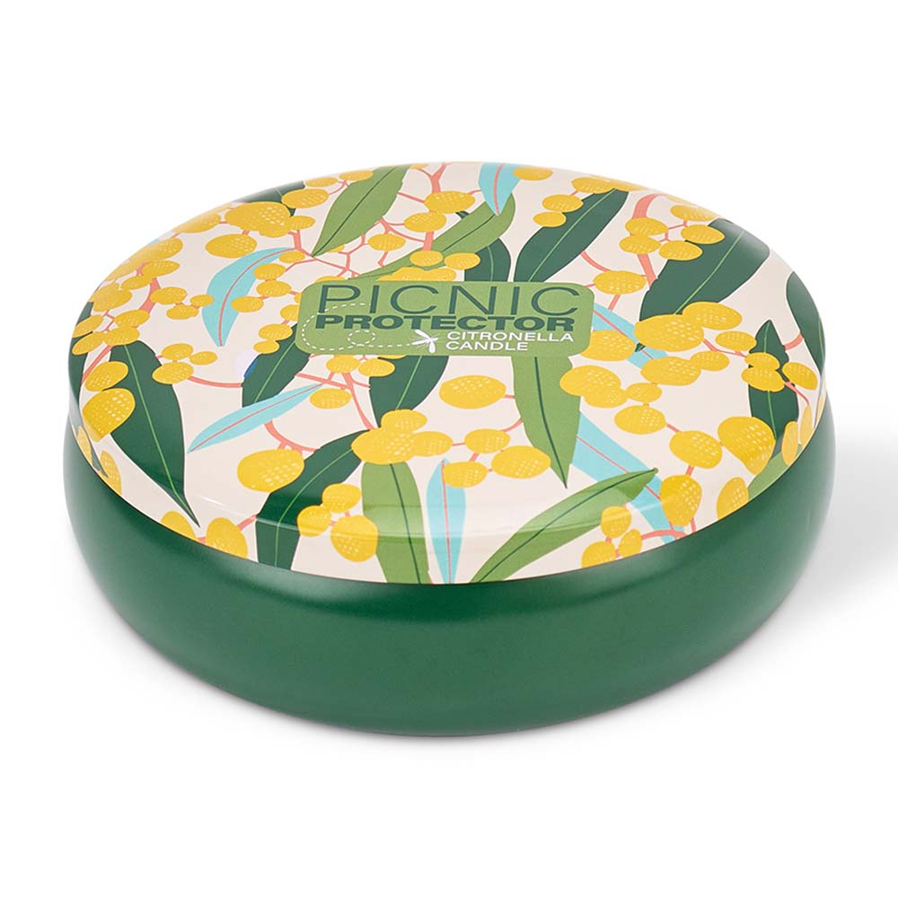Round green container with floral lid on a white background