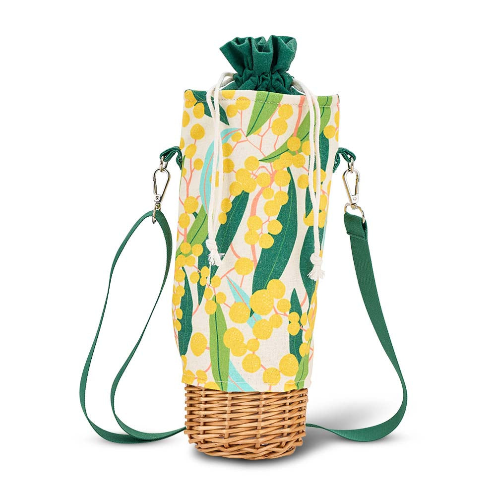 Wine bottle bag with floral pattern and wicker base on a white background