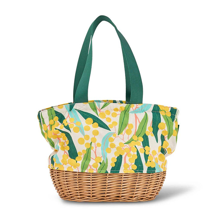 Tote bag with floral pattern and wicker base on a white background
