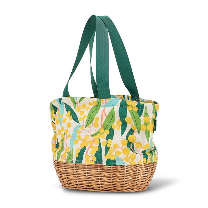 Tote cooler bag with floral pattern and wicker base on a white background