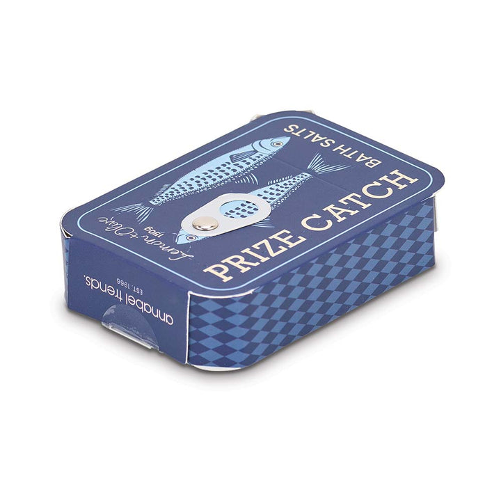 Blue packaging of 'Prize Catch' bath salts with fish illustrations on a white background