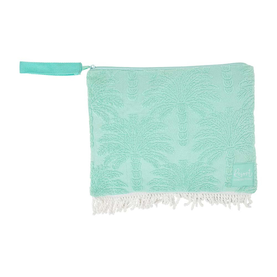 Turquoise towel with white fringe on a white background