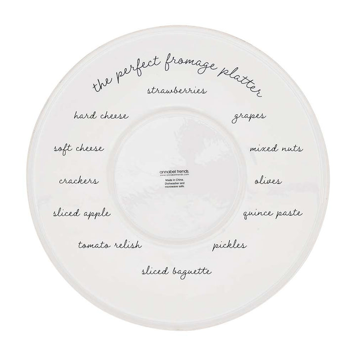 White ceramic platter with text labels for a fromage platter on a white background