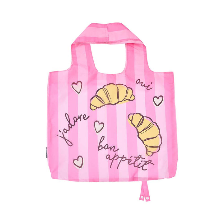 Pink striped reusable bag with croissant illustrations and text on a white background