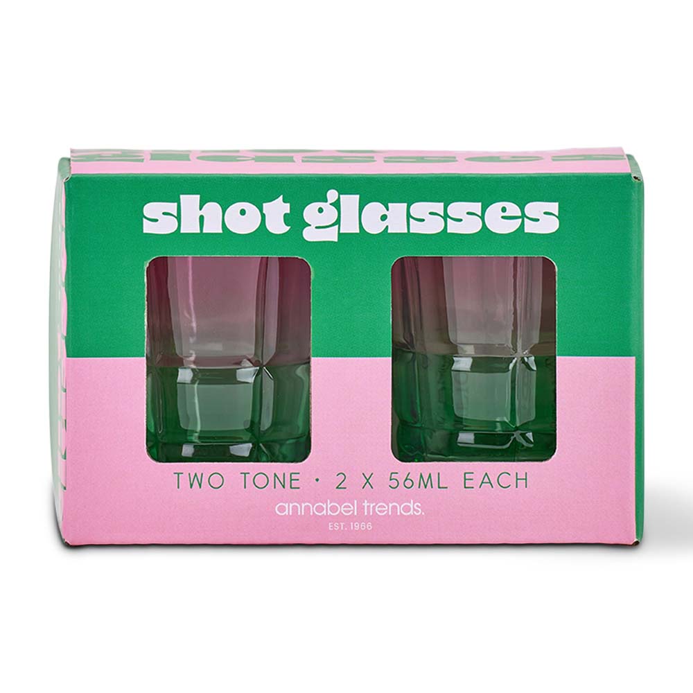Two green shot glasses in a box with pink and green design, labeled 'shot glasses' by annabel Trends.