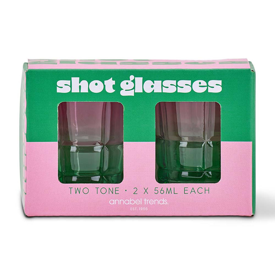 Two green shot glasses in a box with pink and green design, labeled 'shot glasses' by annabel Trends.