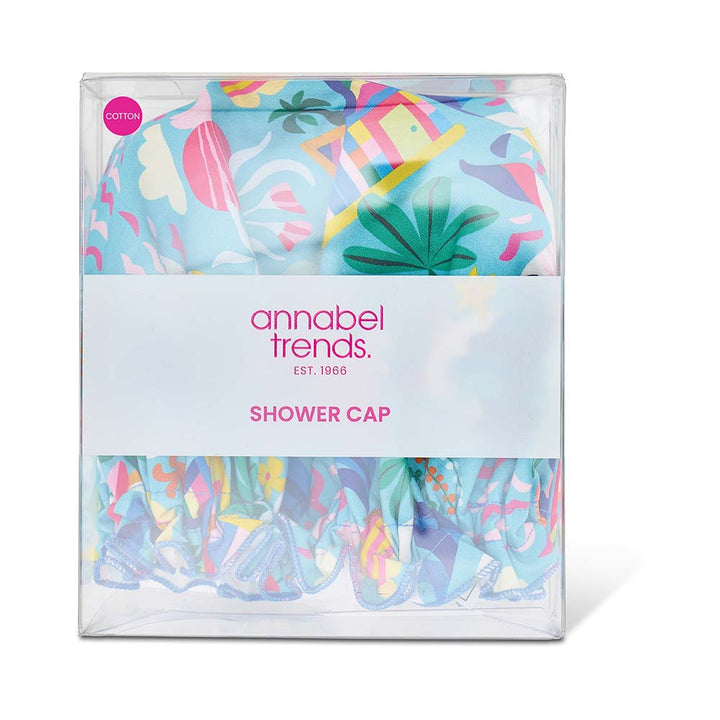 Packaged shower cap with colorful design and 'annabel trends' branding on a white background