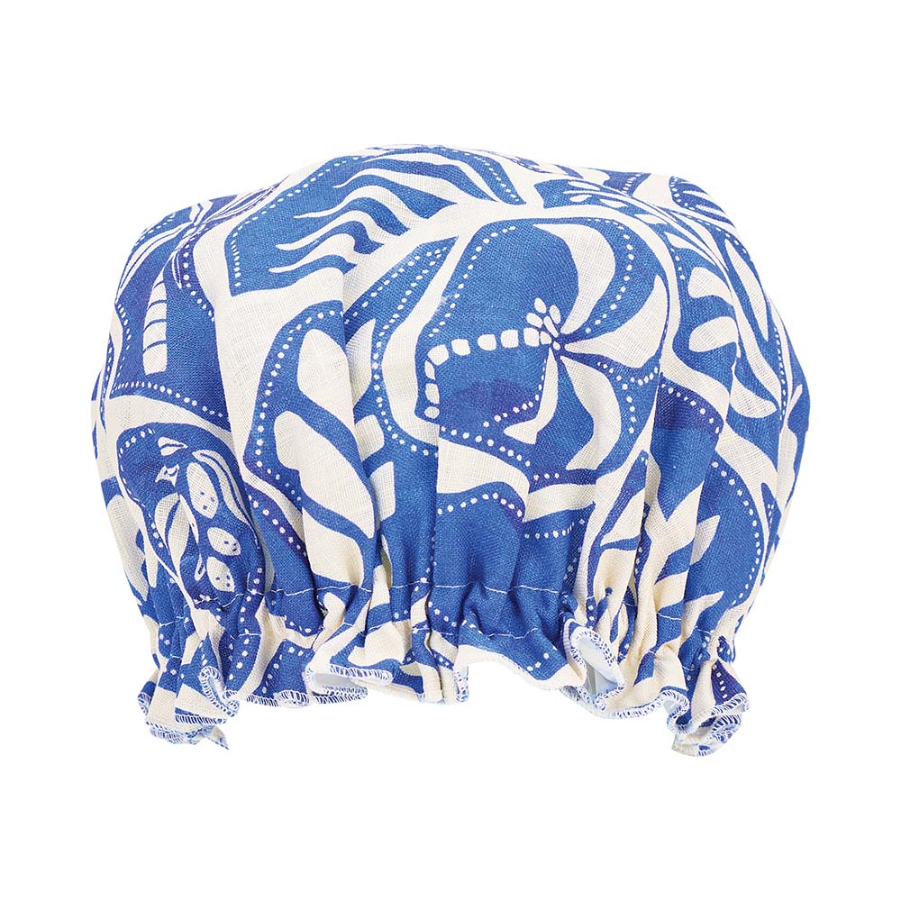 Blue and white patterned shower cap on a white background