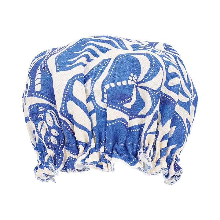 Blue and white patterned shower cap on a white background