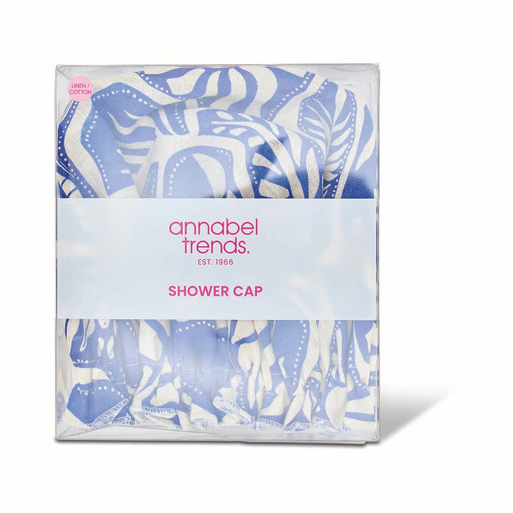Packaged shower cap with blue and white design and 'annabel trends' branding.