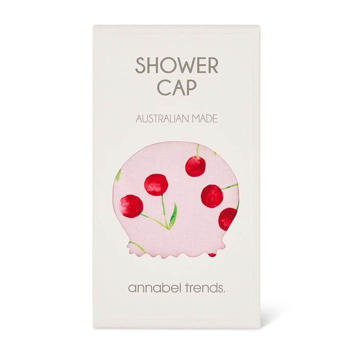 Shower cap packaging with cherry design and 'annabel trends' branding on a white background