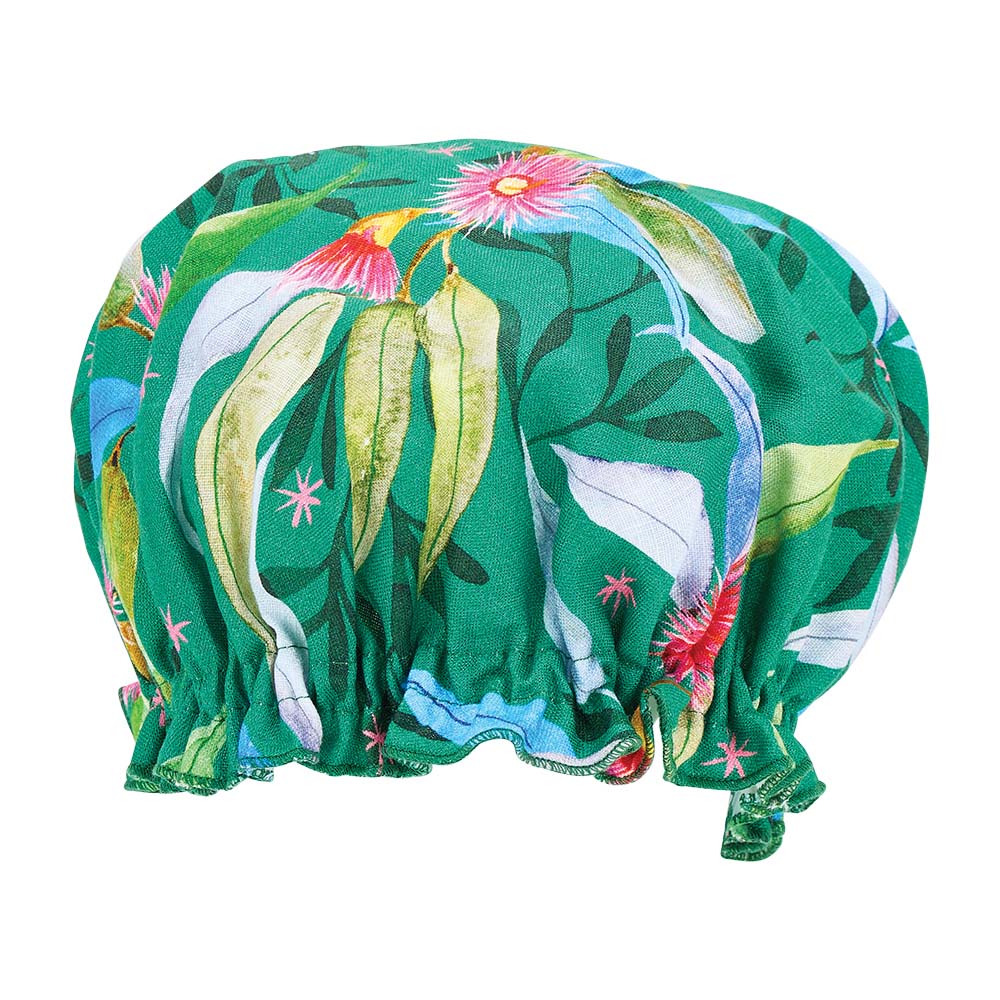 Green shower cap with floral design on a white background