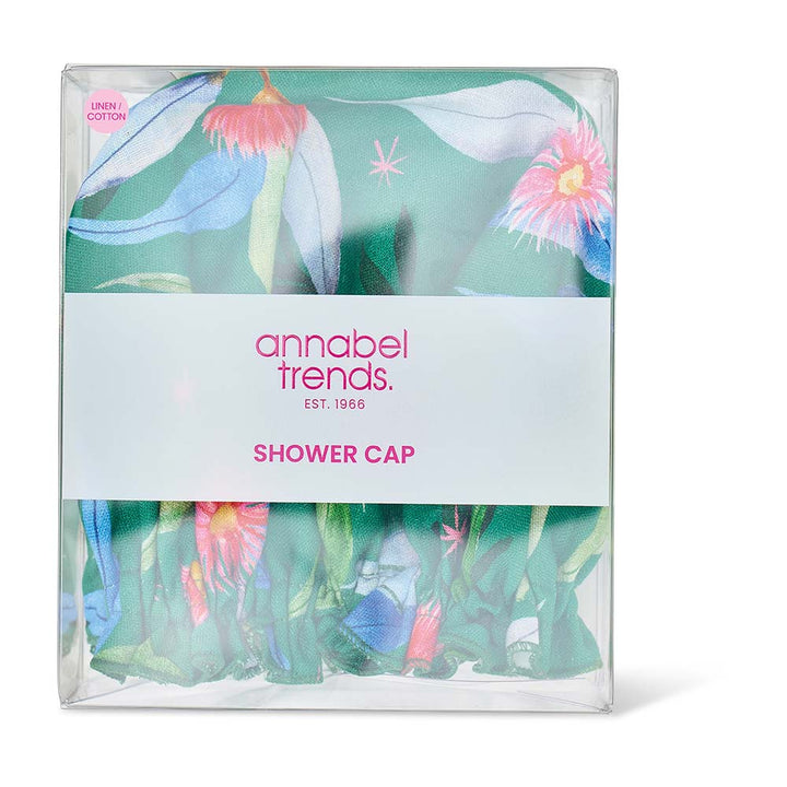 Packaged shower cap with floral design and 'annabel trends' branding on a white background