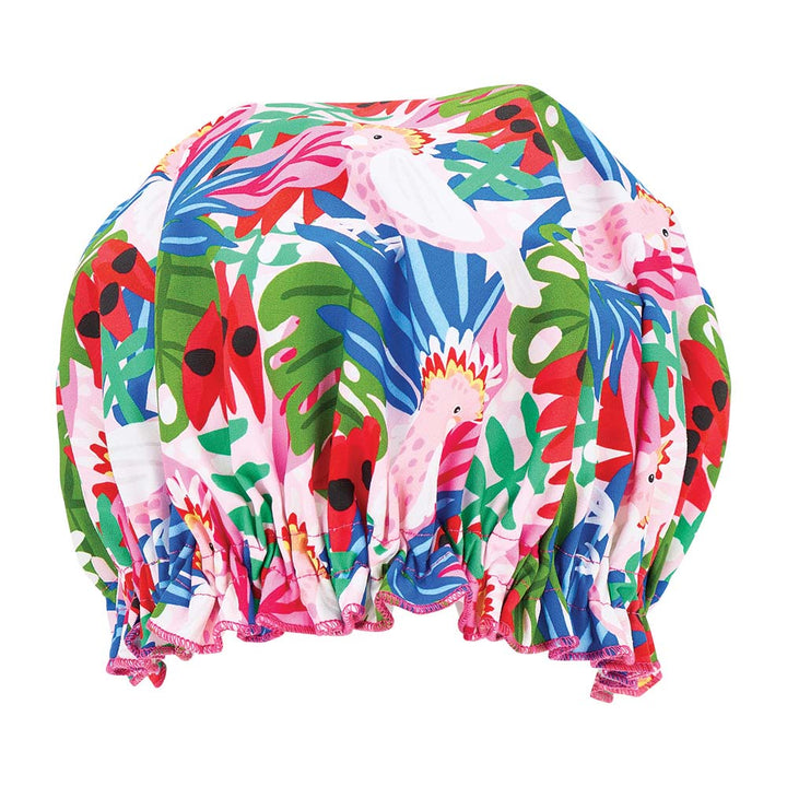 Colorful shower cap with parrot and leaf pattern on a white background