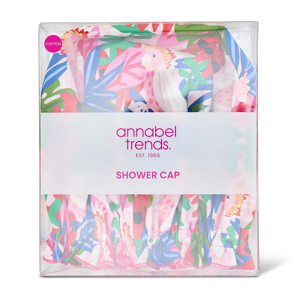 Packaged shower cap with colorful design and 'annabel trends' branding on a white background