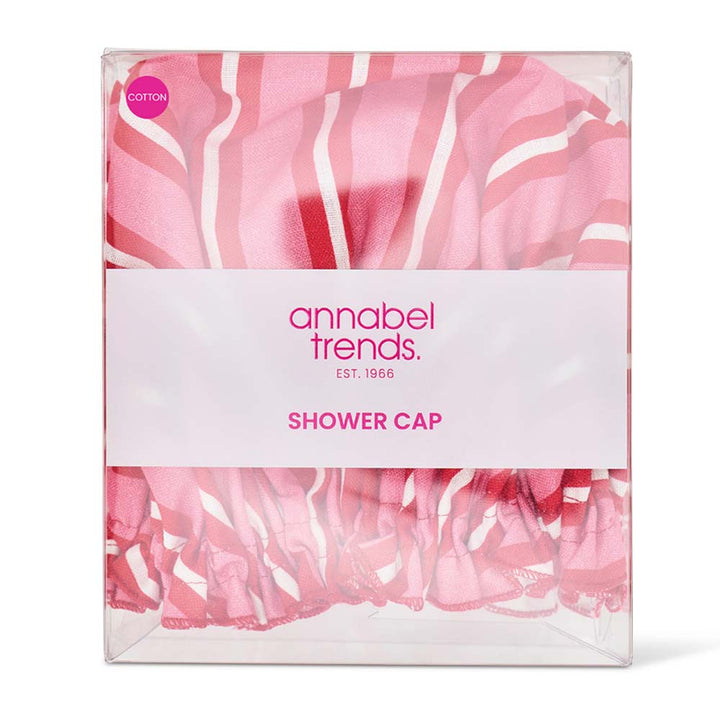 Packaged shower cap with pink and white design and 'annabel trends' branding.