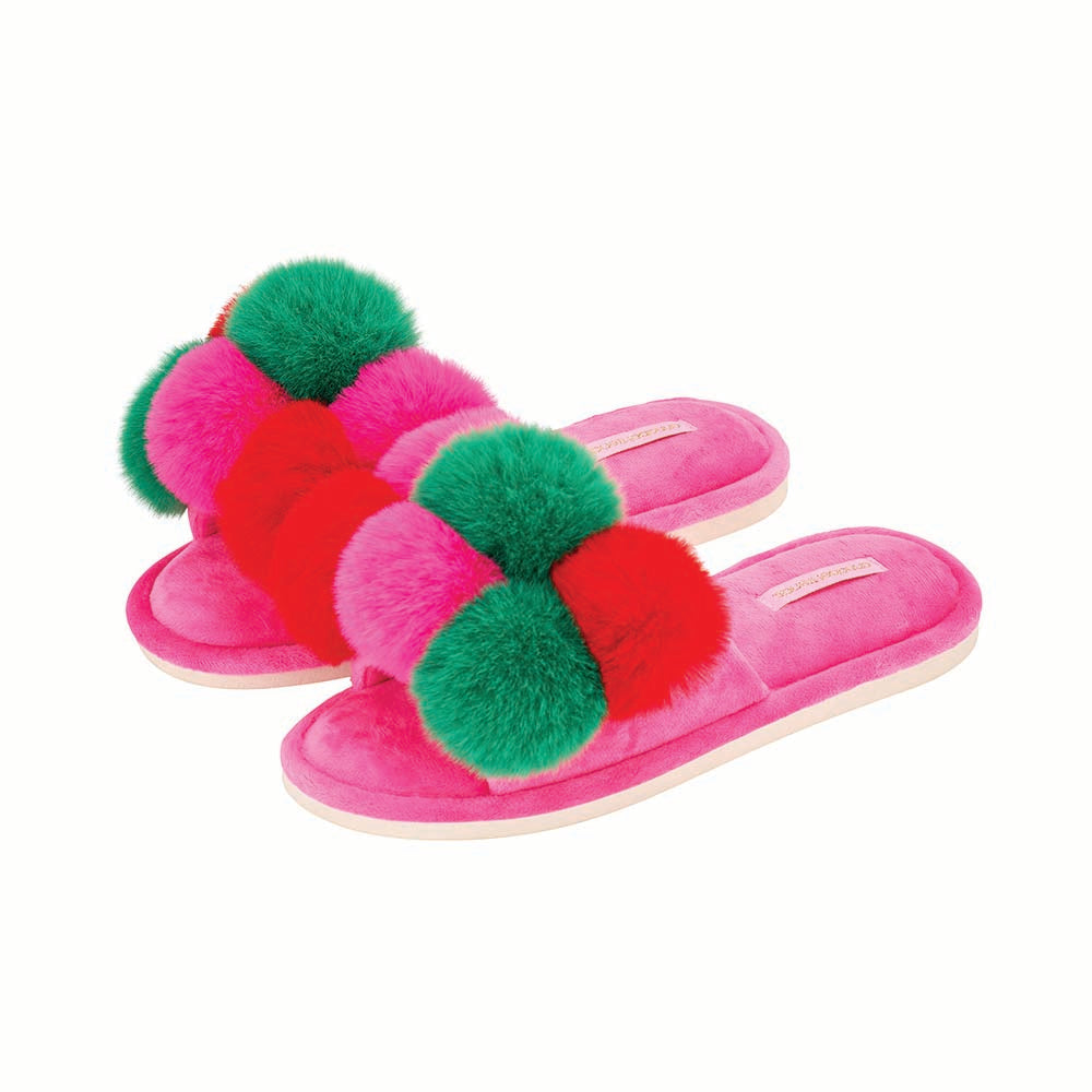 Pair of pink slippers with colorful pom-poms on a white background