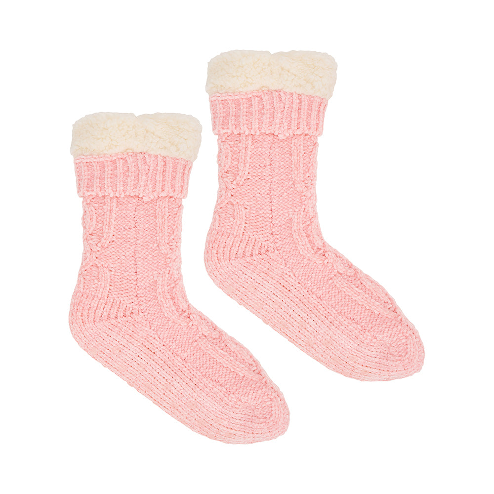 Pair of pink knitted sherpa lined socks on a white background