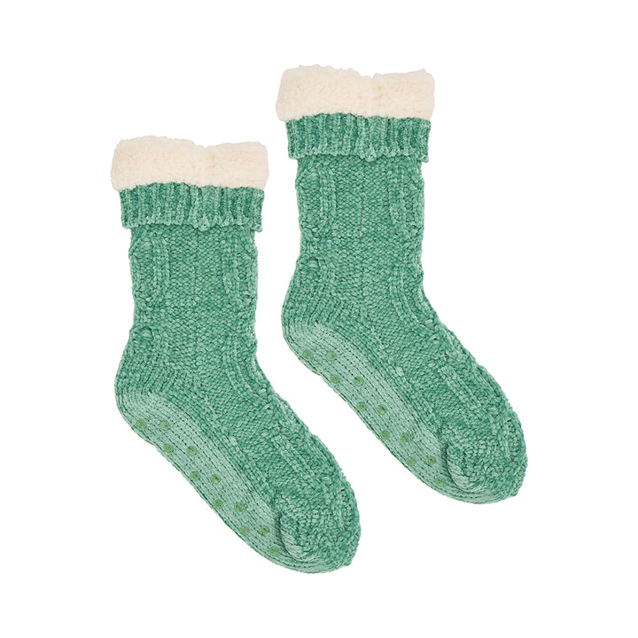 Pair of sage green knitted sherpa lined socks on a white background