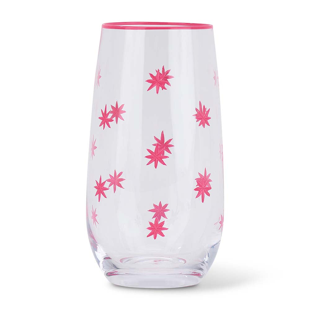Clear glass tumbler with pink floral patterns on a white background