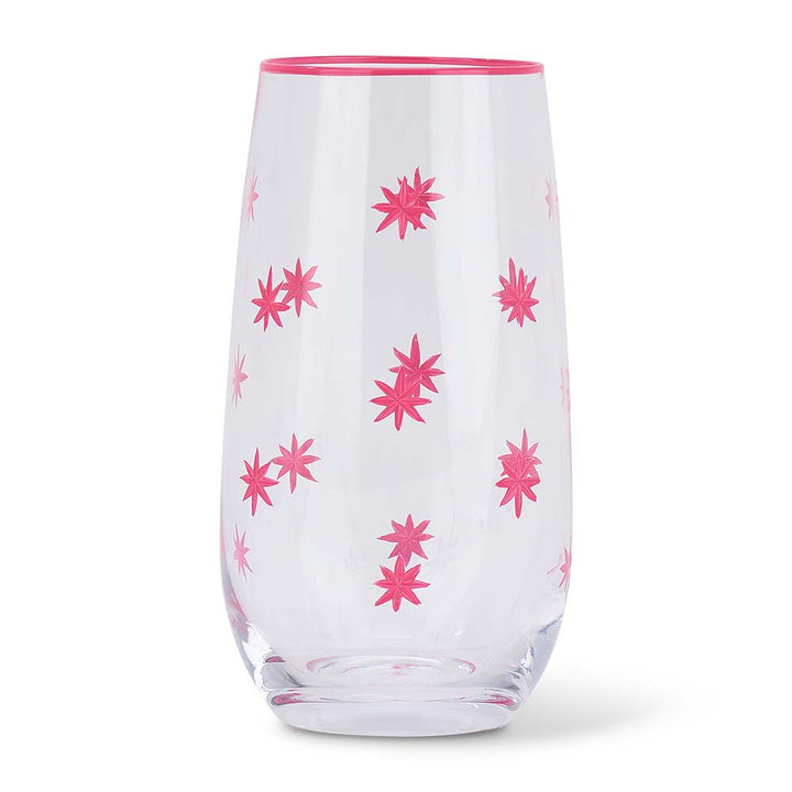Clear glass tumbler with pink floral patterns on a white background