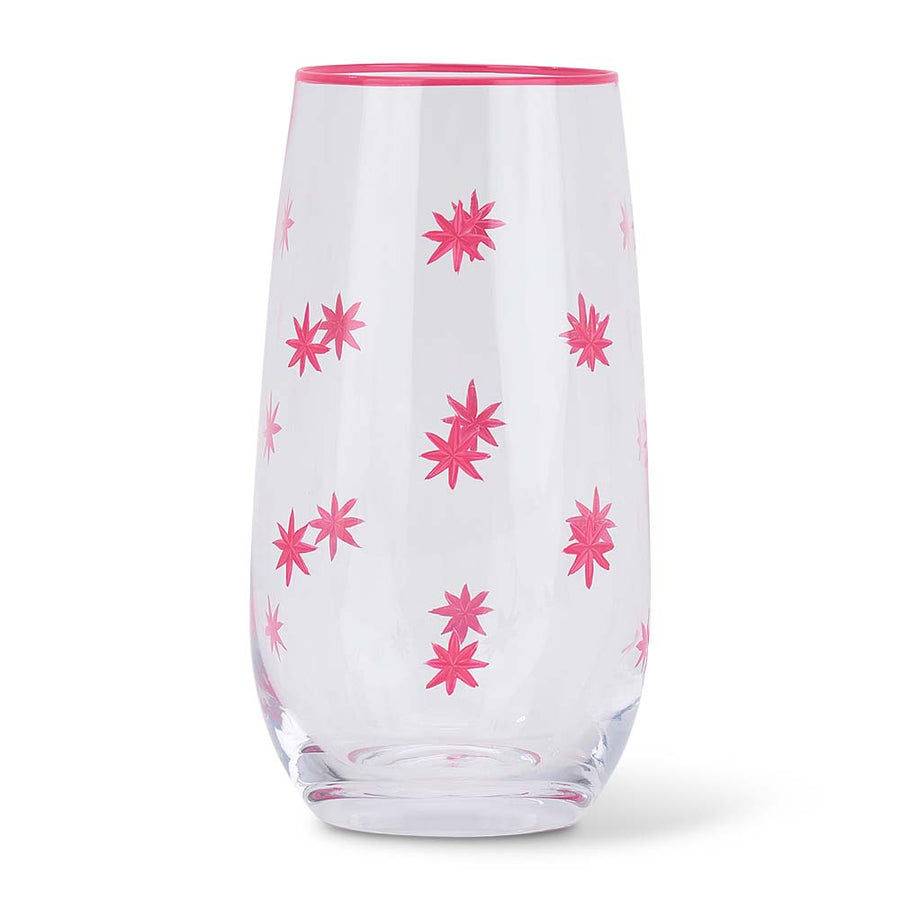 Clear glass tumbler with pink floral patterns on a white background