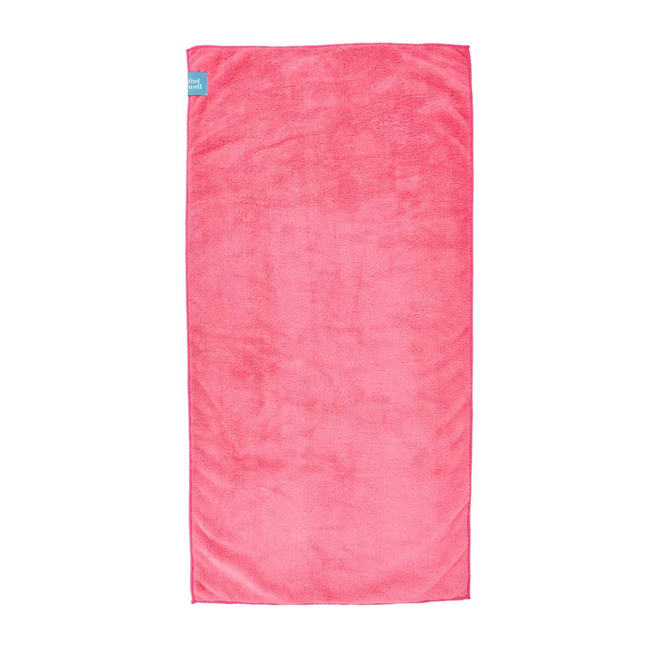 Pink towel with a blue label on a white background