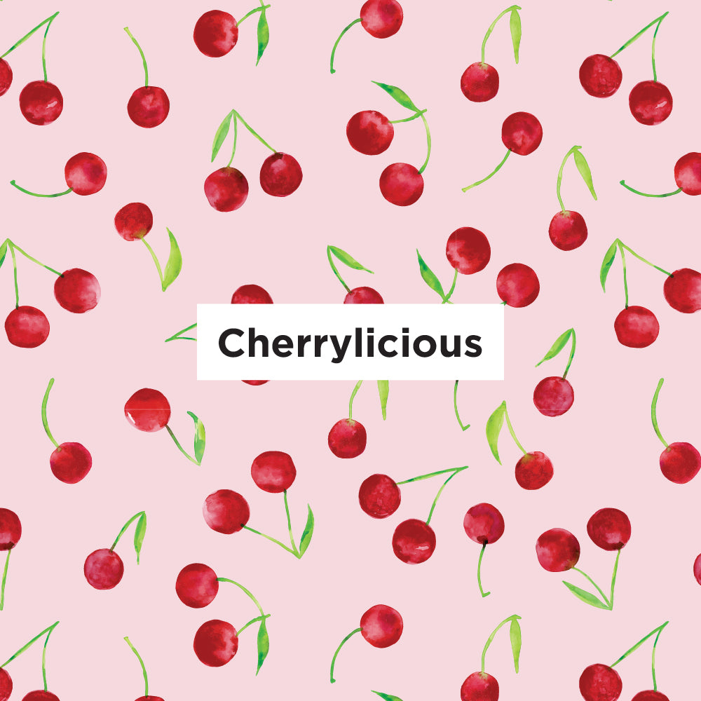 Pattern of red cherries with green stems on a pink background, featuring the word 'Cherrylicious'.