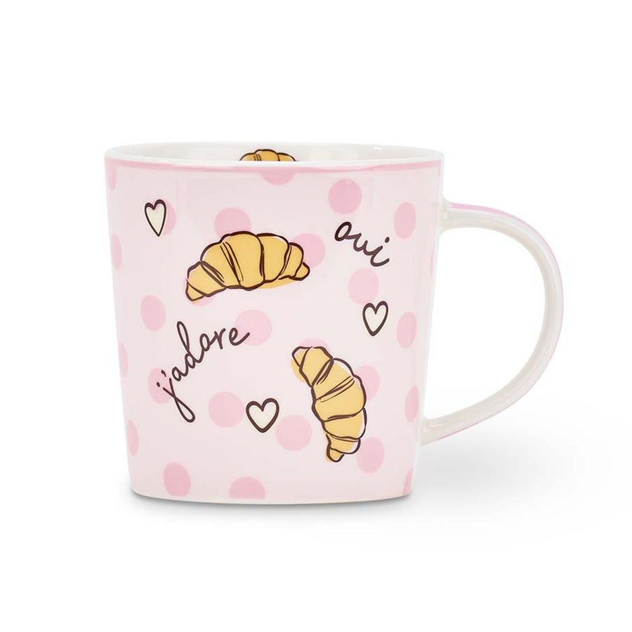 Pink mug with croissant illustrations and text on a white background