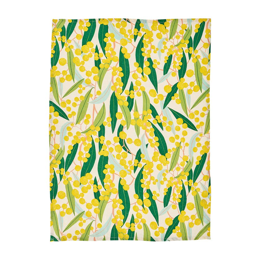 Patterned tea towel with yellow flowers and green leaves on a white background