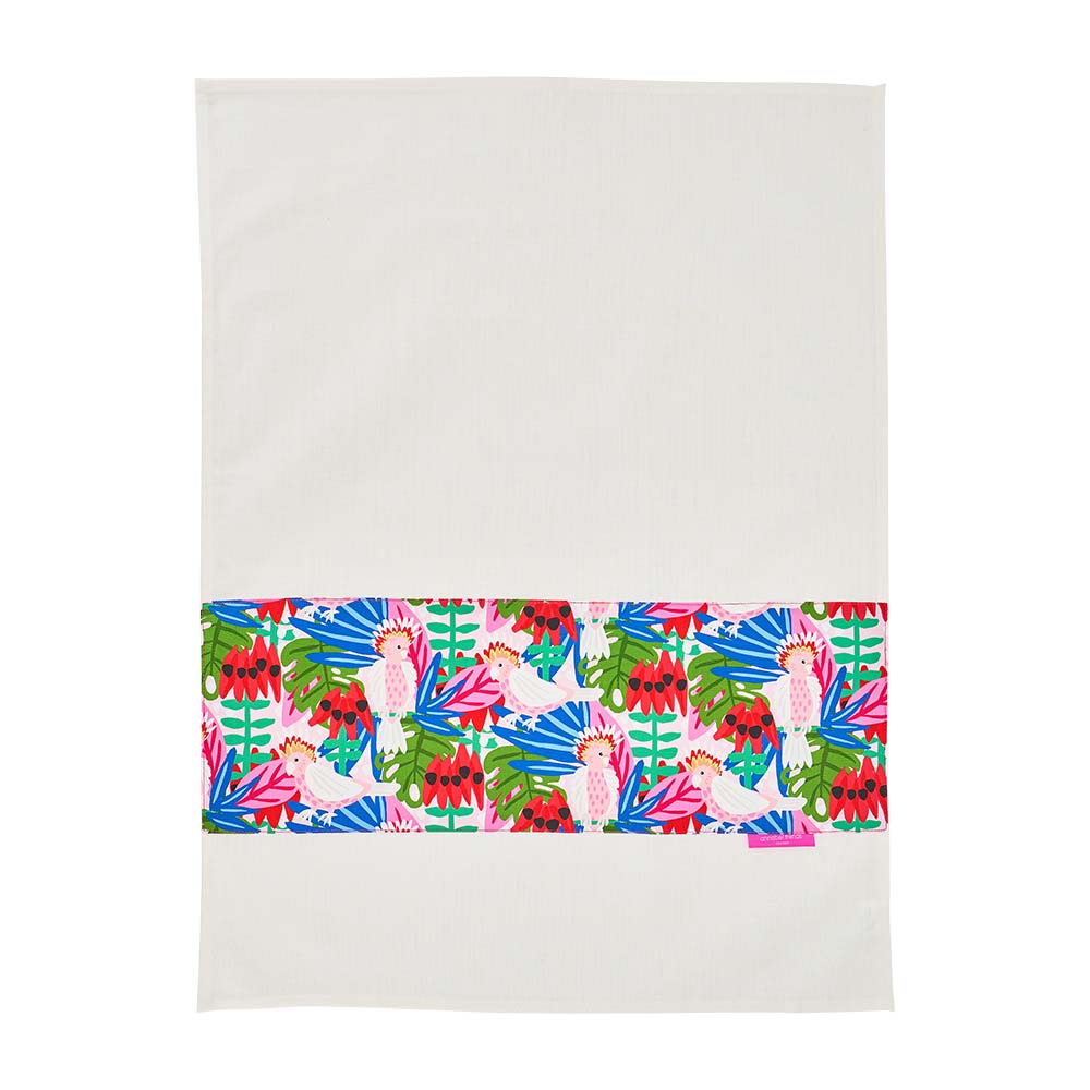 Colorful tropical patterned tea towel on a white background