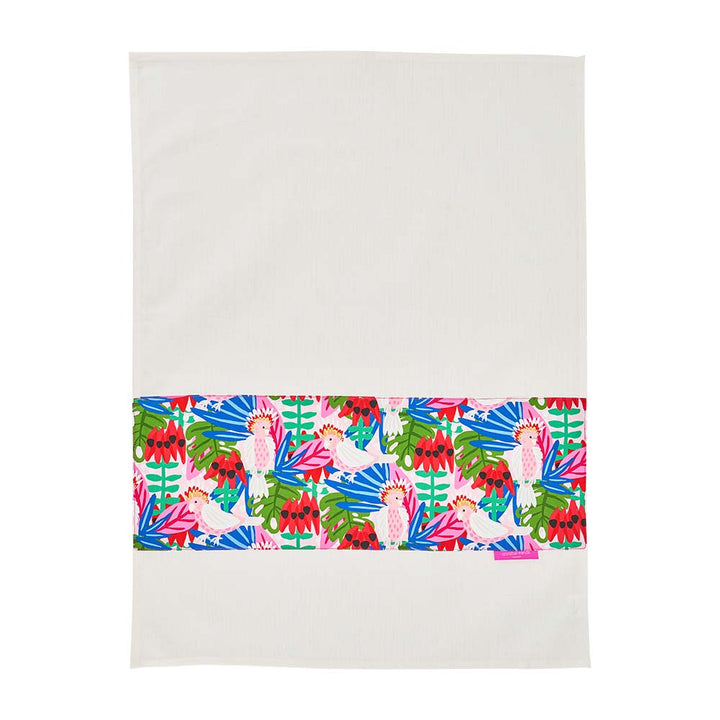 Colorful tropical patterned tea towel on a white background