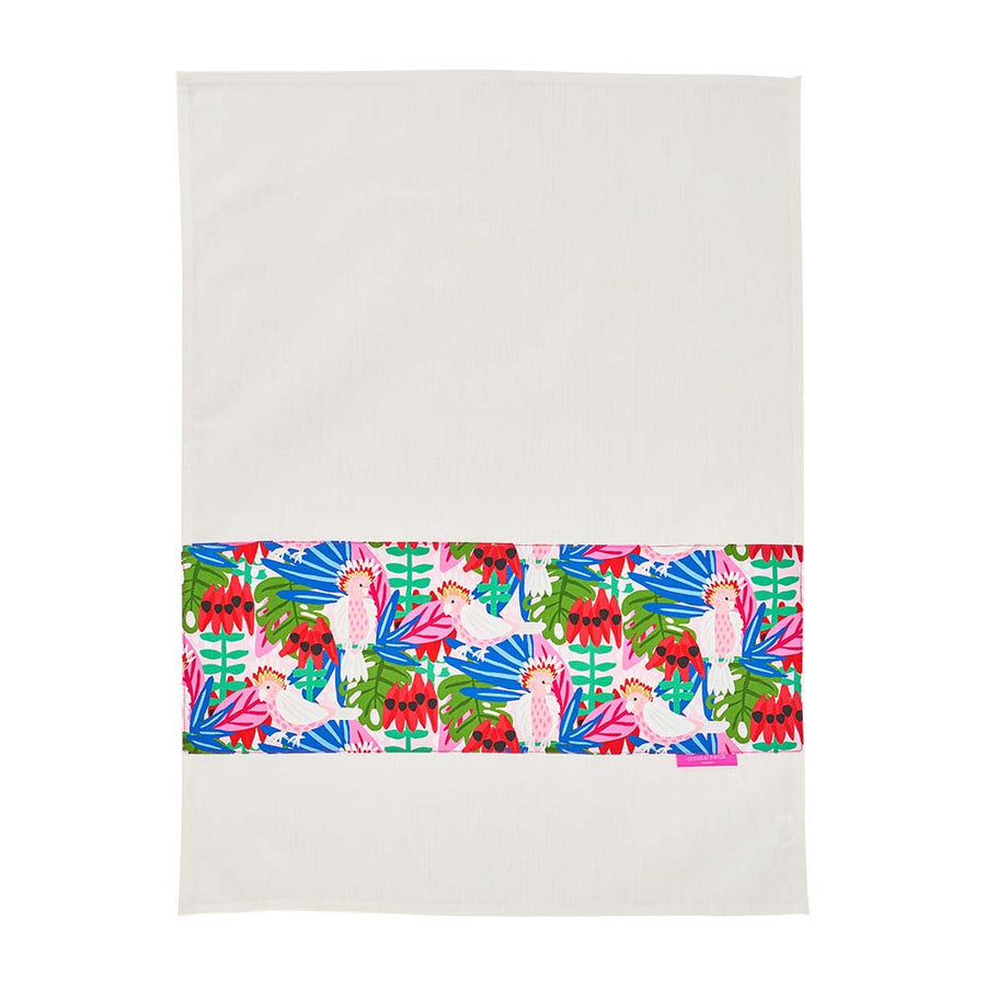 Colorful tropical patterned tea towel on a white background