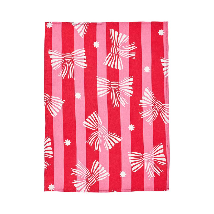 Red and pink striped tea towel with white bow patterns