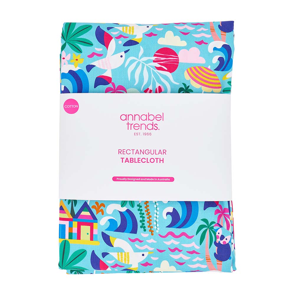 Colorful tablecloth with beach theme packaging by annabel trends on a white background
