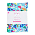 Colorful tablecloth with beach theme packaging by annabel trends on a white background