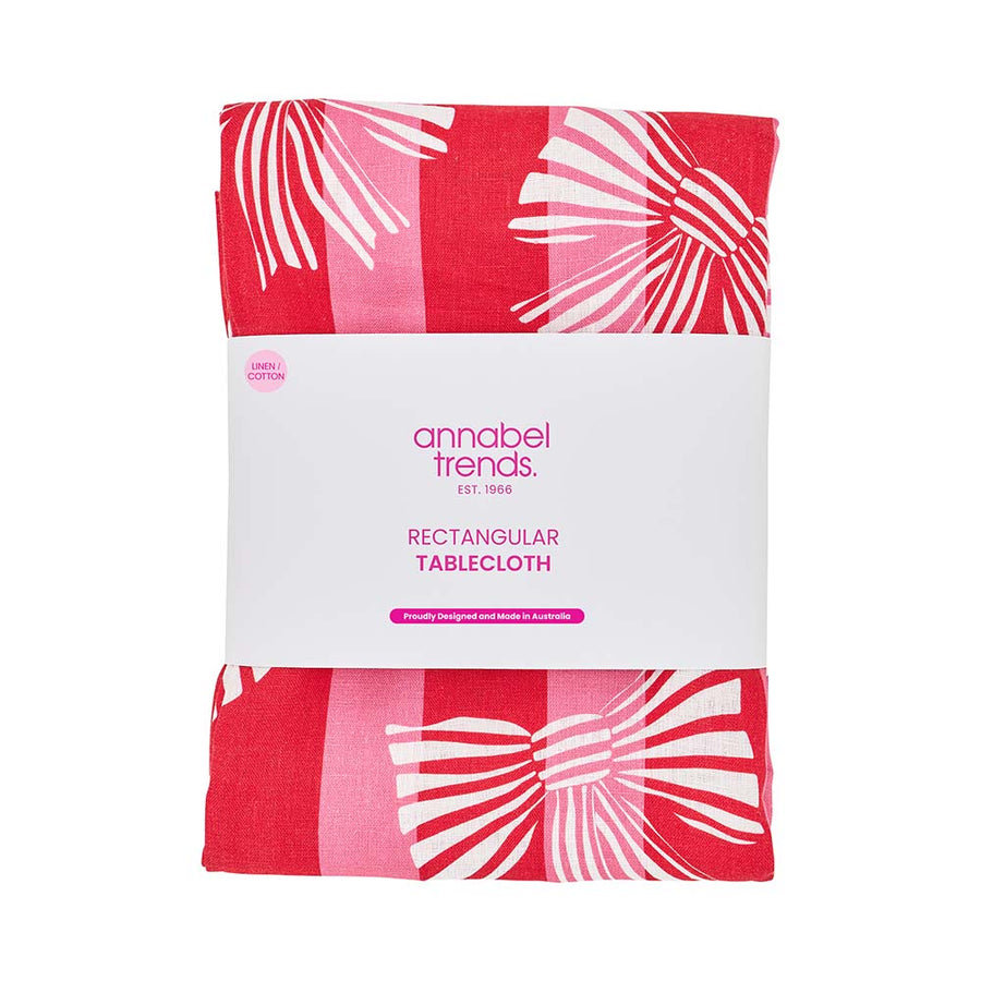 Red and white patterned tablecloth with 'annabel trends' packaging on a white background
