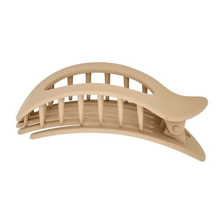 Beige hair clip on a white background