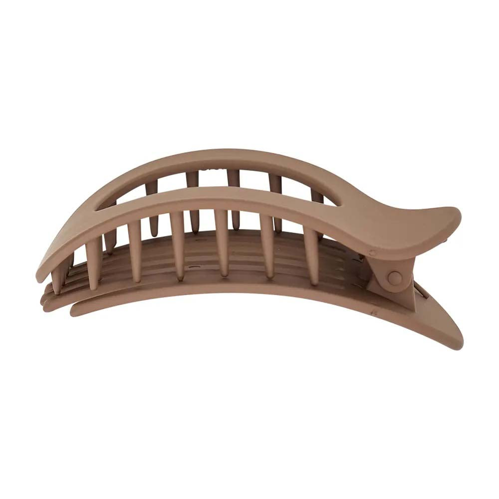 Beige hair clip on a white background