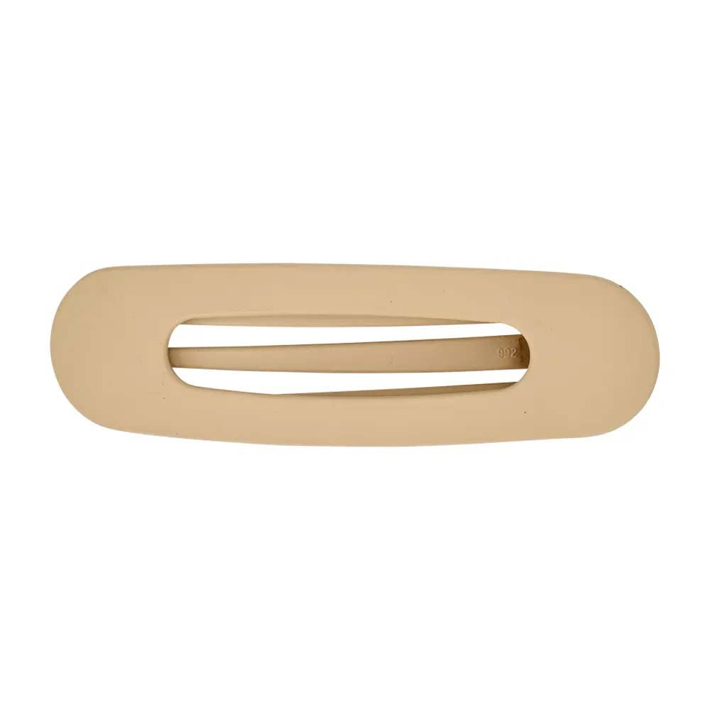 Beige hair clip on a white background