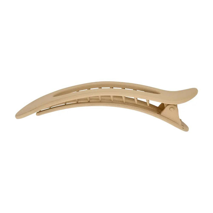 Gold hair clip on a white background