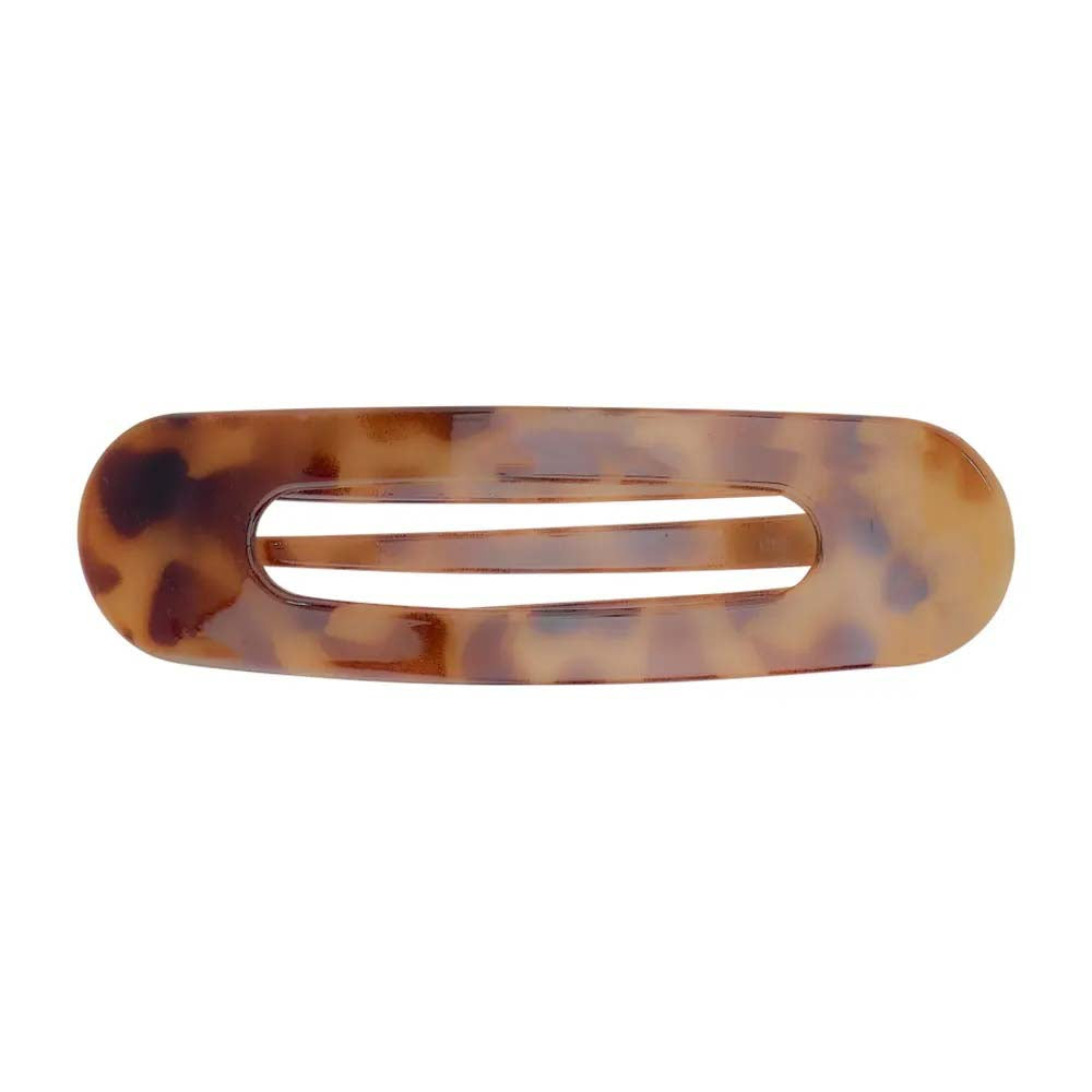 Tortoiseshell patterned hair clip on a white background