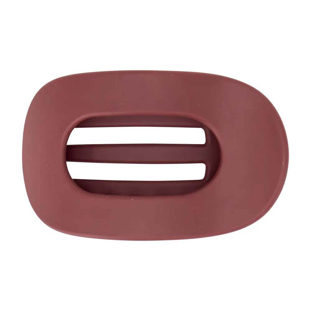 Plum hair clasp on white background
