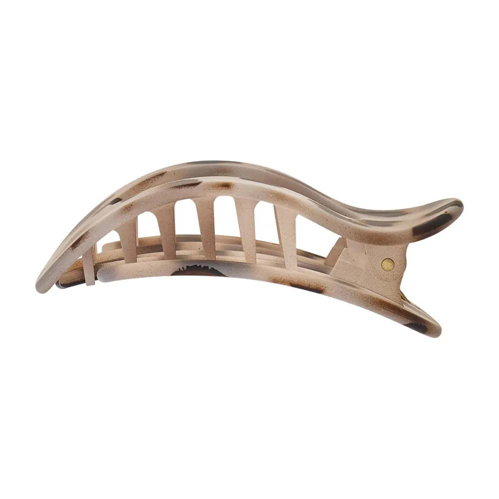 Beige hair clip on a white background